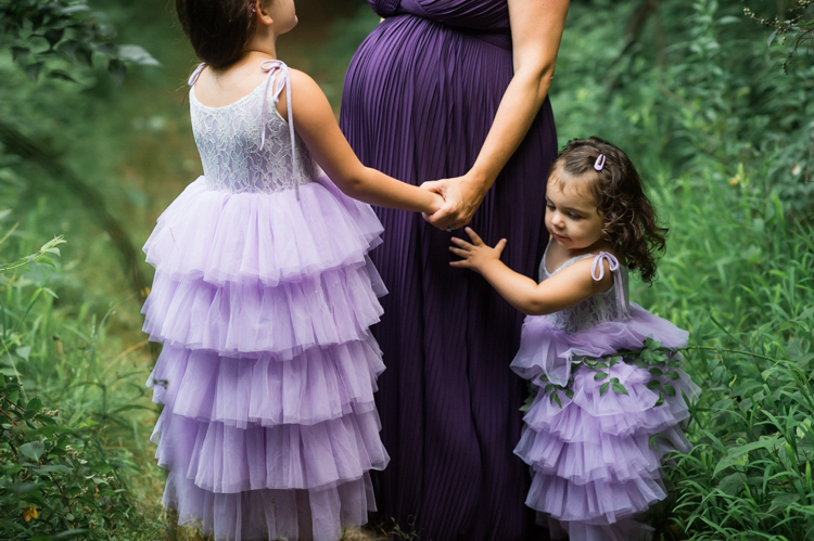 I was thrilled when Michelle from Pink Comb Studio reached out for her maternity photos. Following COVID-19 rule, keeping social distance I photographed Michelle and her two beautiful girls at Watchung Mountain NJ. With overcast weather three trees and grass showed such a rich deep green colors. I love bold rich colors in my photos as much as I love sunset golden hour. Michelle was just glowing and looked so beautiful. Was so happy to have such a beautiful mama in front of my camera before Michelle becomes mama of three girls. I can not wait to see her new baby girl and see her family grow. Michelle Surgent’s maternity session captured by Karis from heykaris.